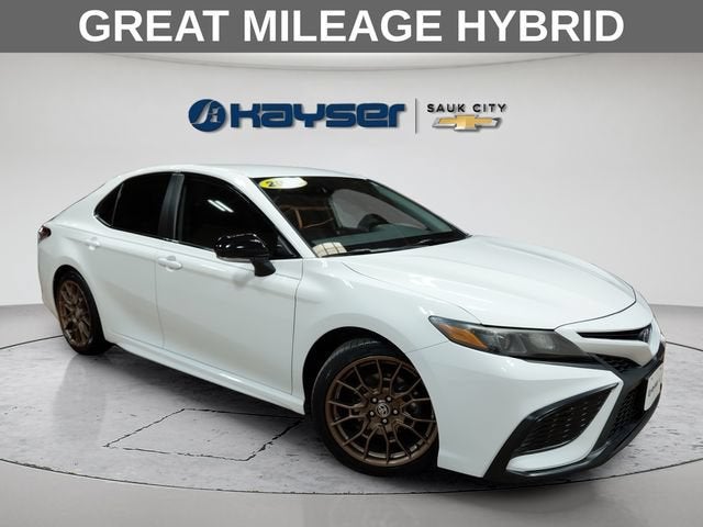 2023 Toyota Camry SE Nightshade Edition Hybrid in White — front three-quarter view